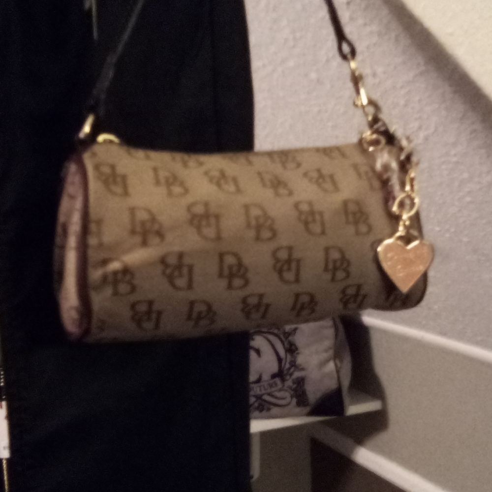 Like new Dooney and Burke duffel purse with charm